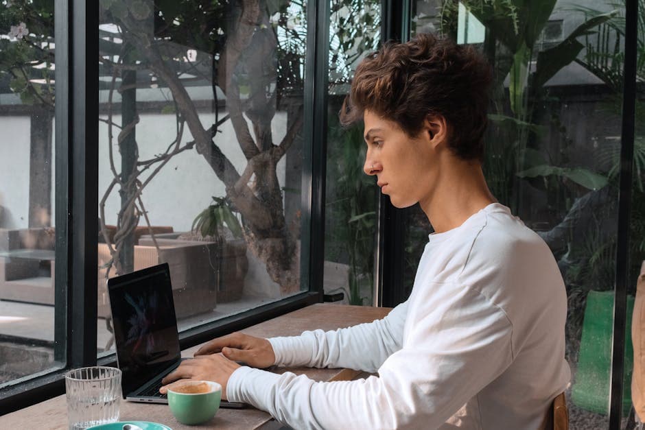 An independent professional focused on client work at a cafe